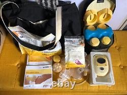 Medela freestyle double electric pump with milk storage pouches, and extras