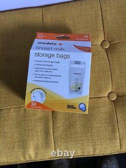 Medela freestyle double electric pump with milk storage pouches, and extras